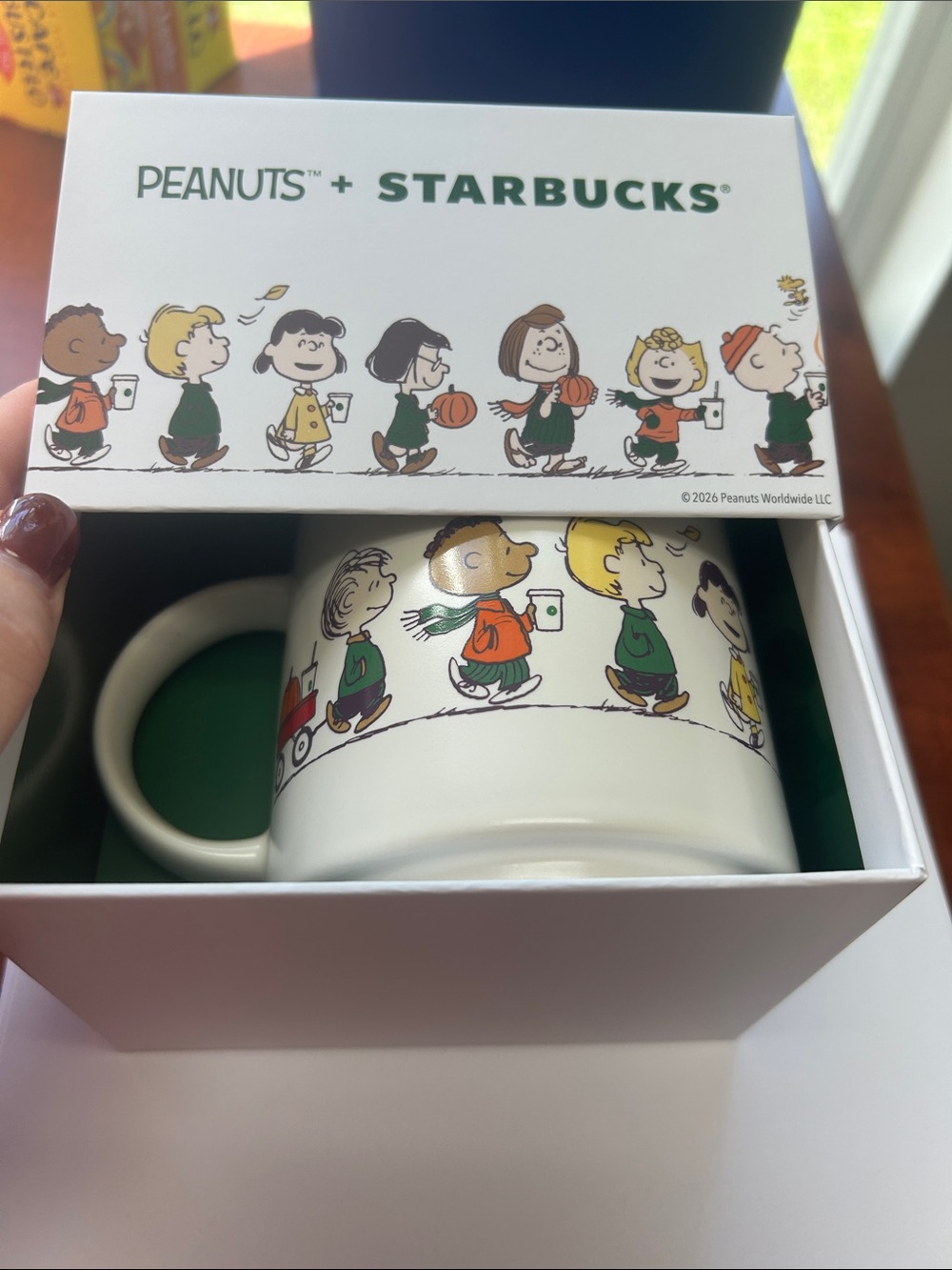 Starbucks x Peanuts White Mug with Green, Orange, Yellow, Brown Characters